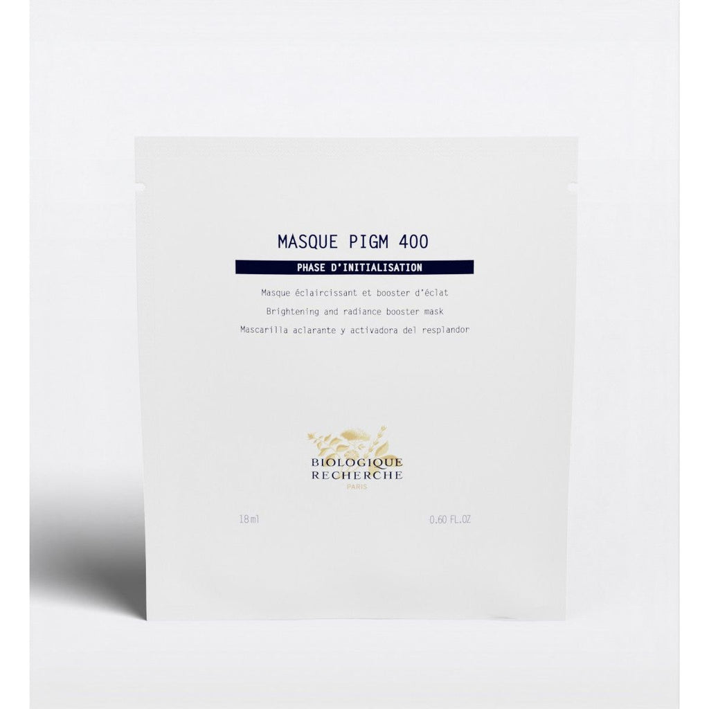 Flatlay of Biologique Recherche Masque PIGM 400 single-use mask for dark spots and dull skin